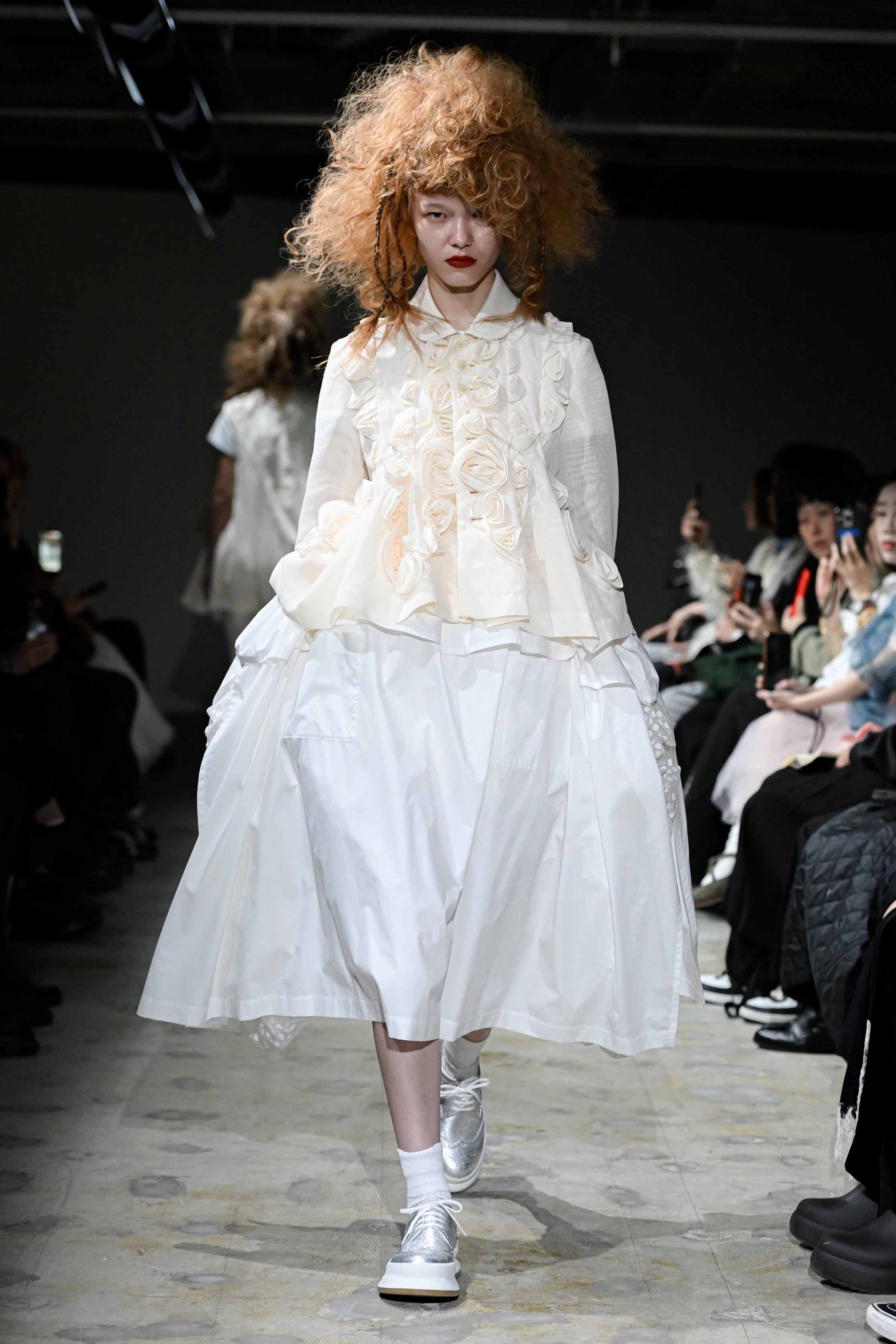 Fashion model wearing a tao SS26 outfit