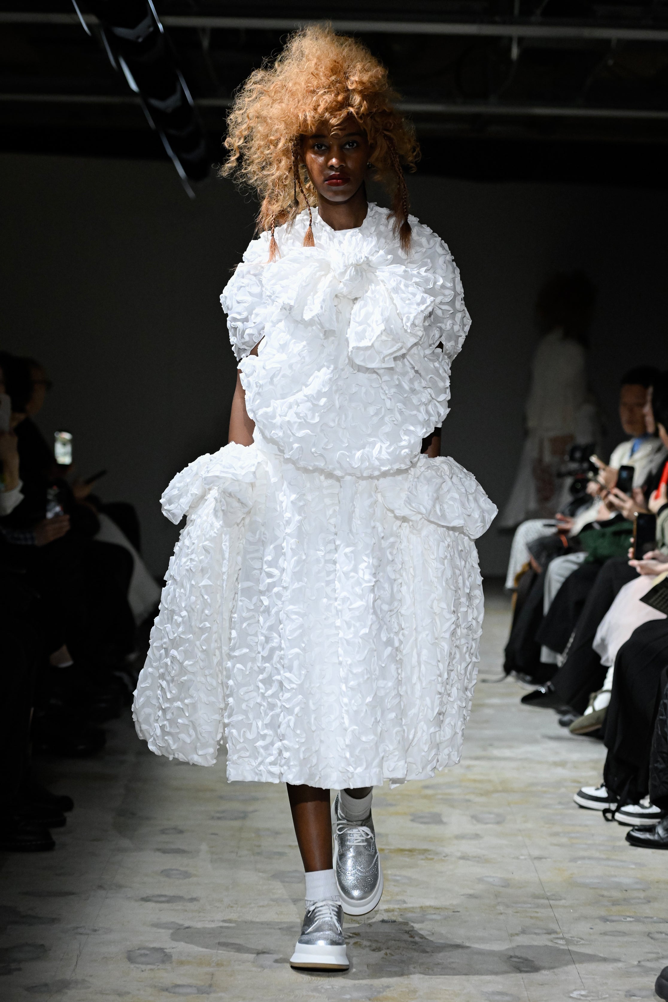 Fashion model wearing a tao SS26 outfit