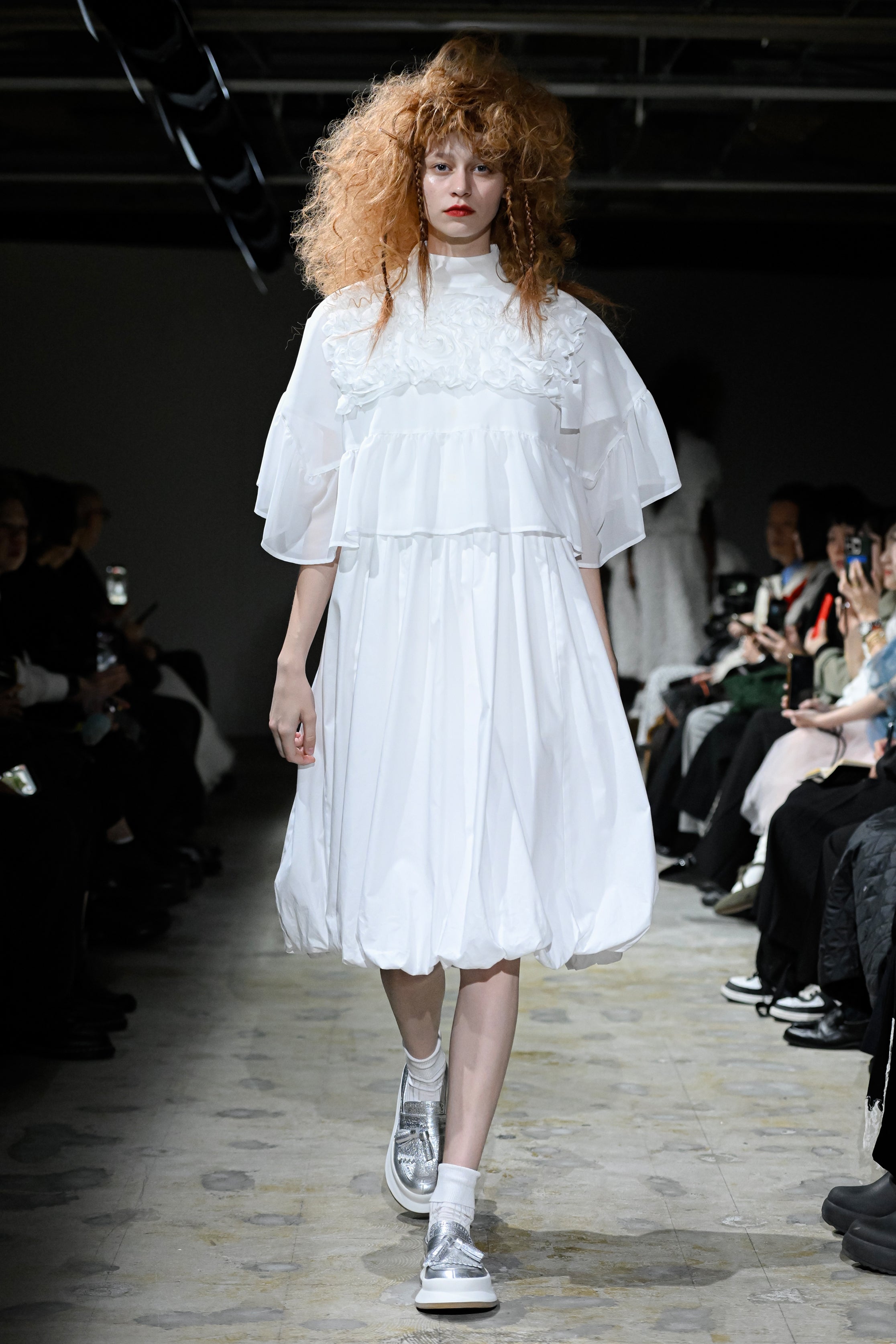 Fashion model wearing a tao SS26 outfit