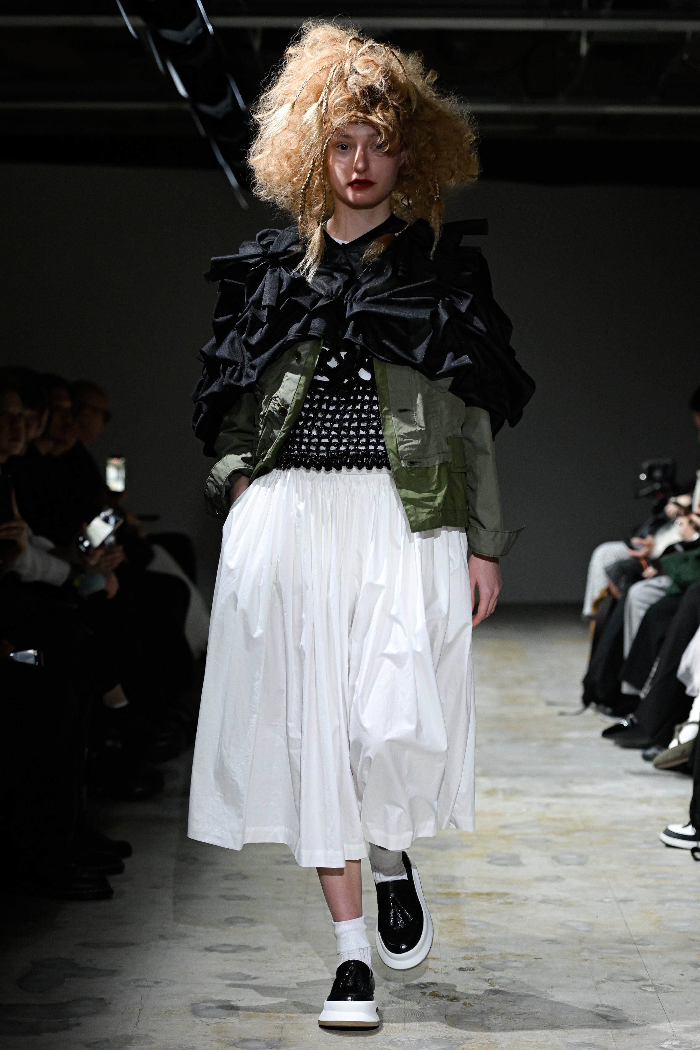 Fashion model wearing a tao SS26 outfit