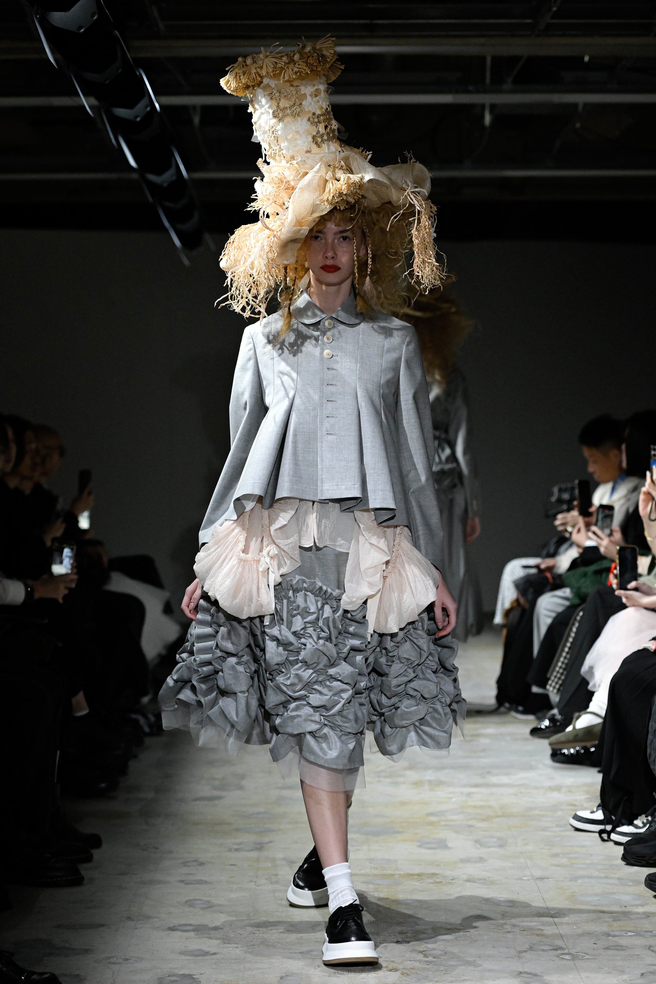 Fashion model wearing a tao SS26 outfit