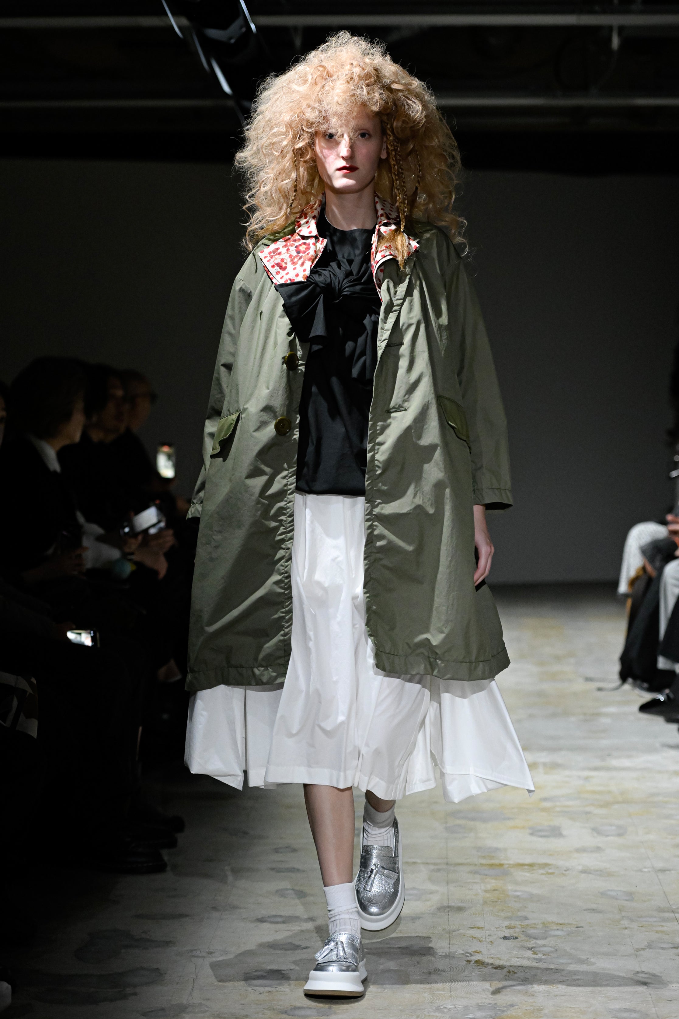 Fashion model wearing a tao SS26 outfit