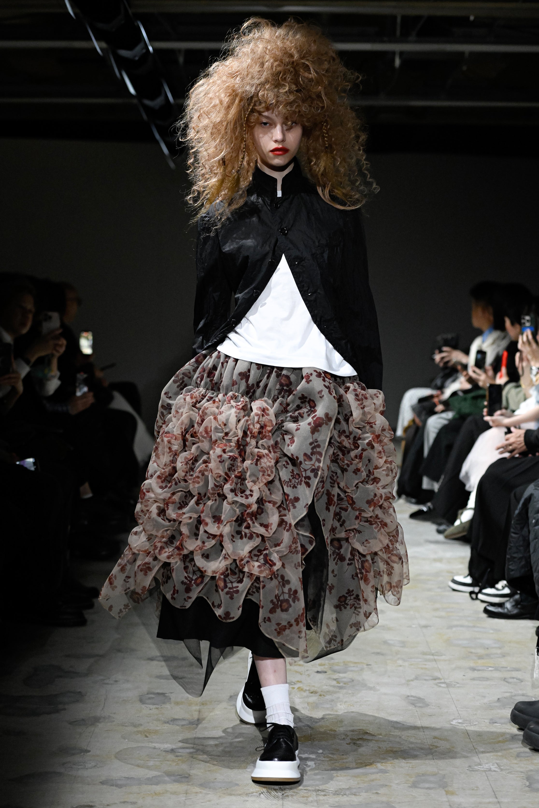 Fashion model wearing a tao SS26 outfit