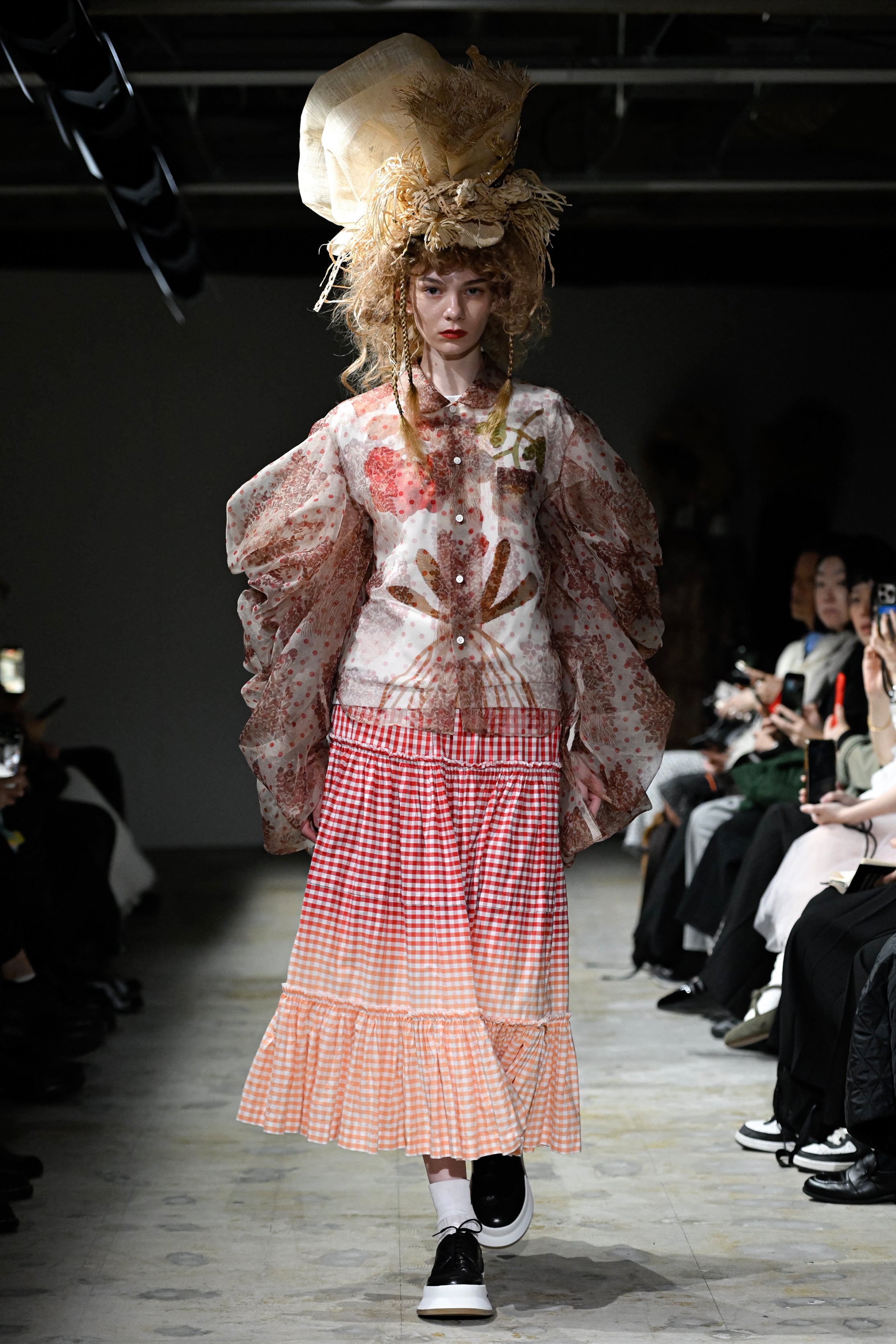 Fashion model wearing a tao SS26 outfit