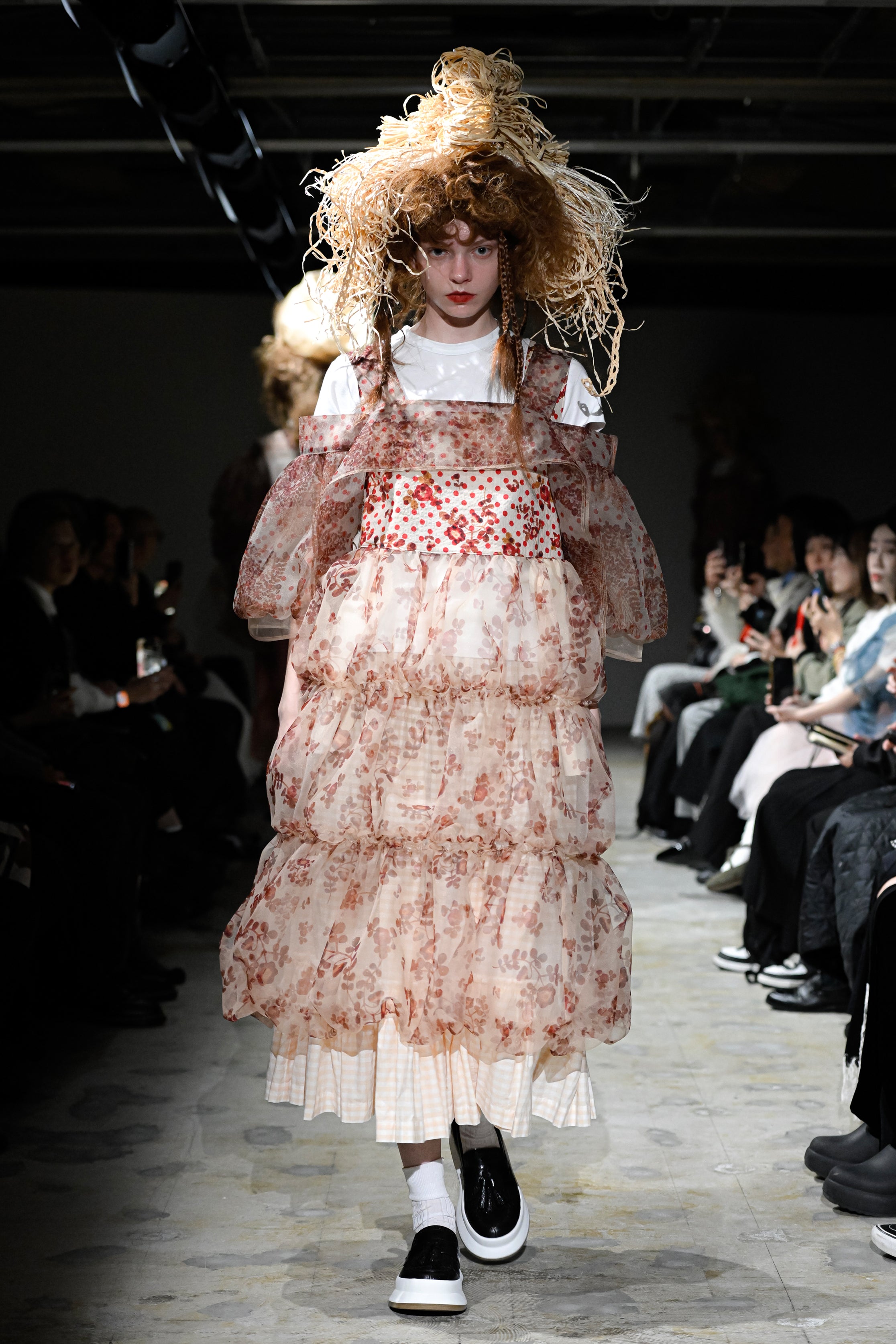 Fashion model wearing a tao SS26 outfit