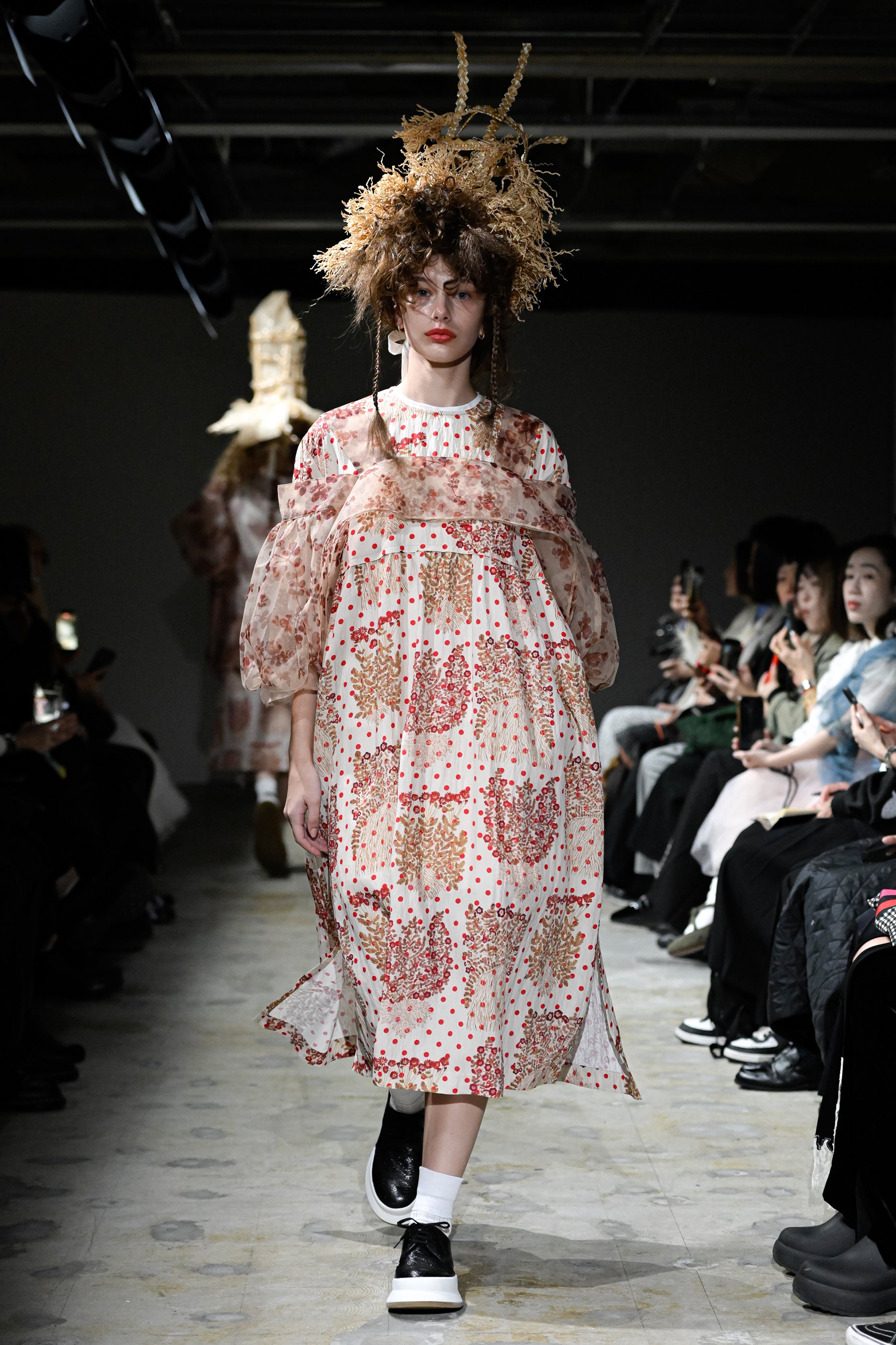 Fashion model wearing a tao SS26 outfit