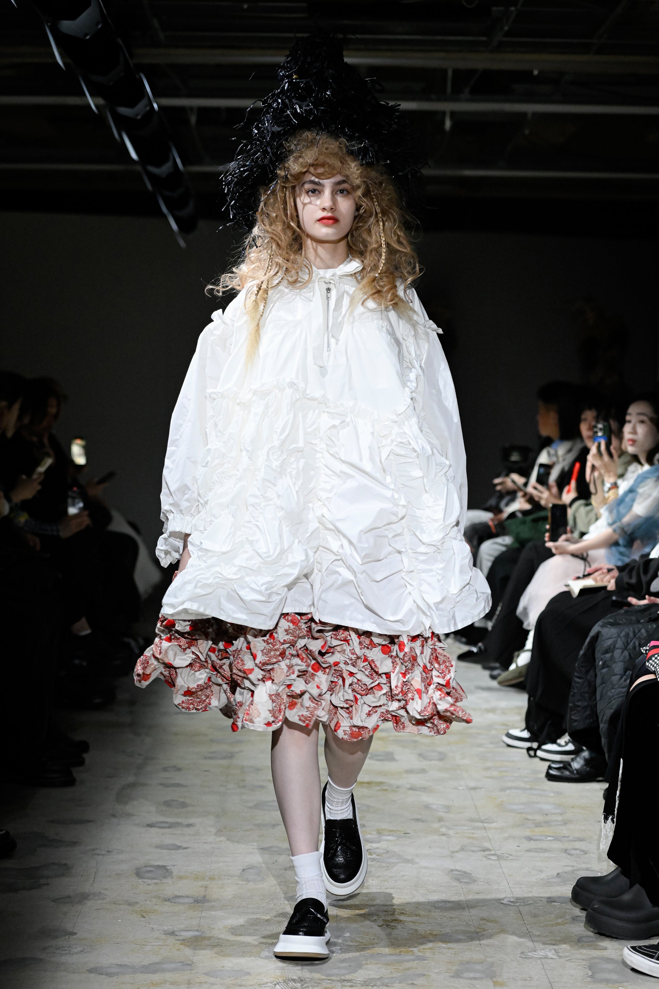 Fashion model wearing a tao SS26 outfit