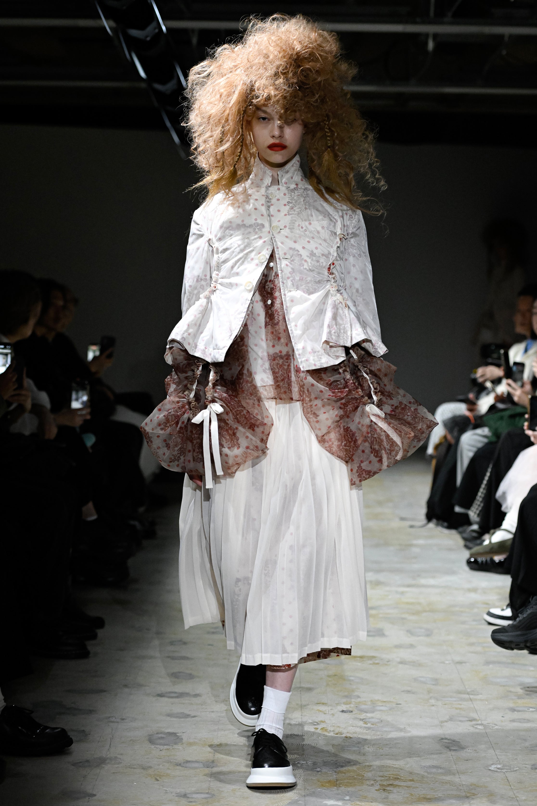 Fashion model wearing a tao SS26 outfit