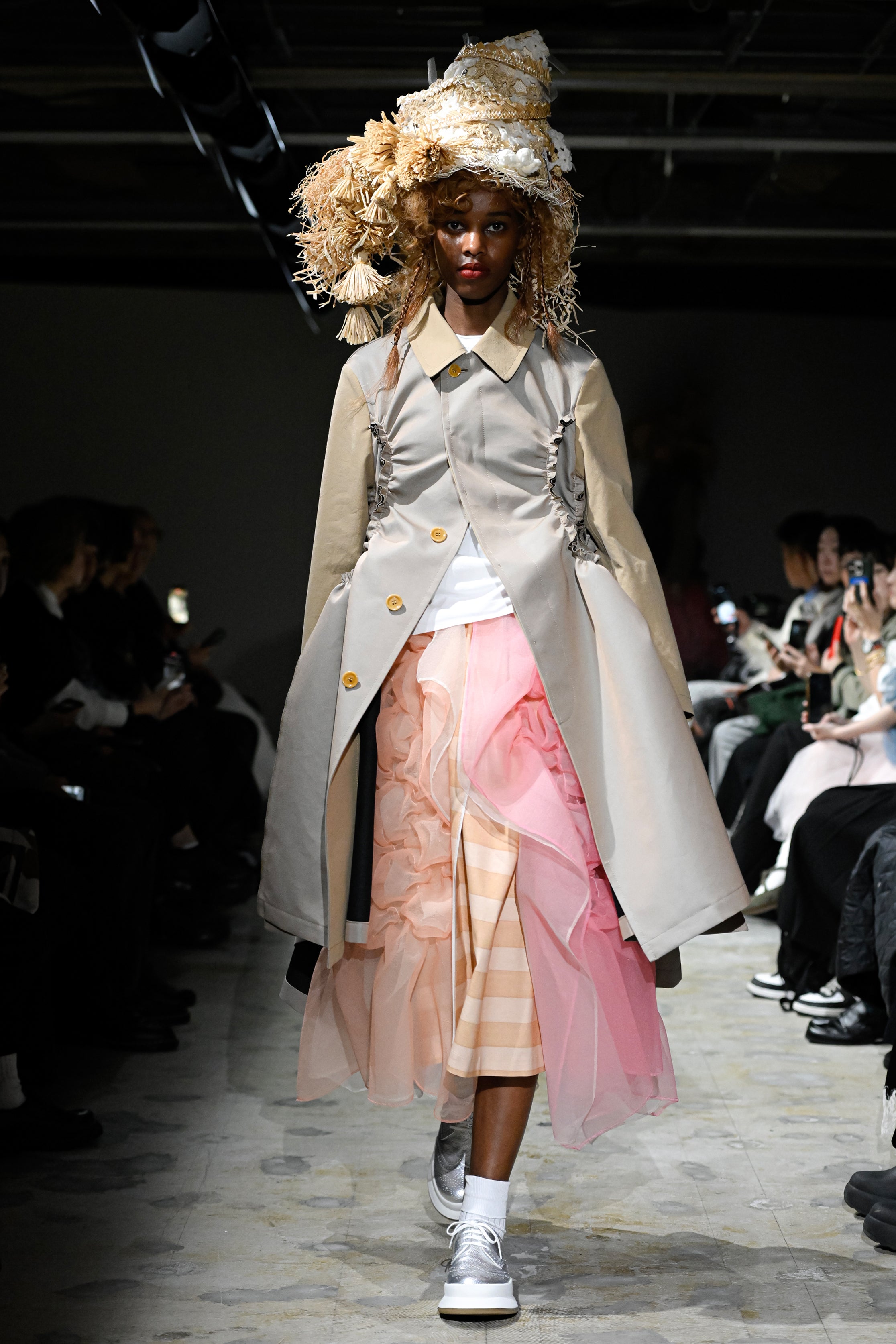 Fashion model wearing a tao SS26 outfit