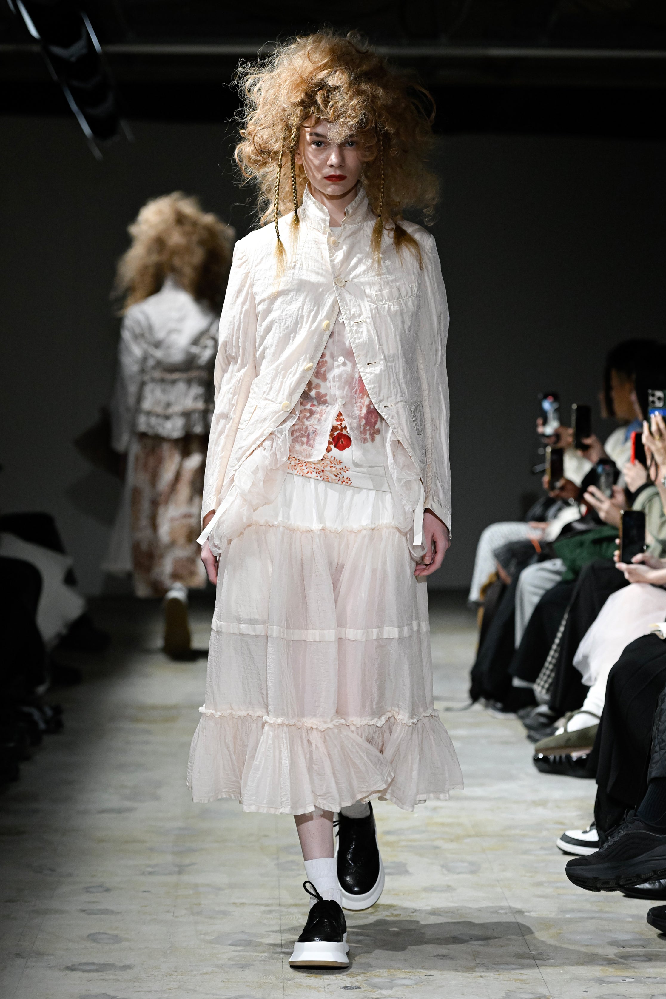 Fashion model wearing a tao SS26 outfit