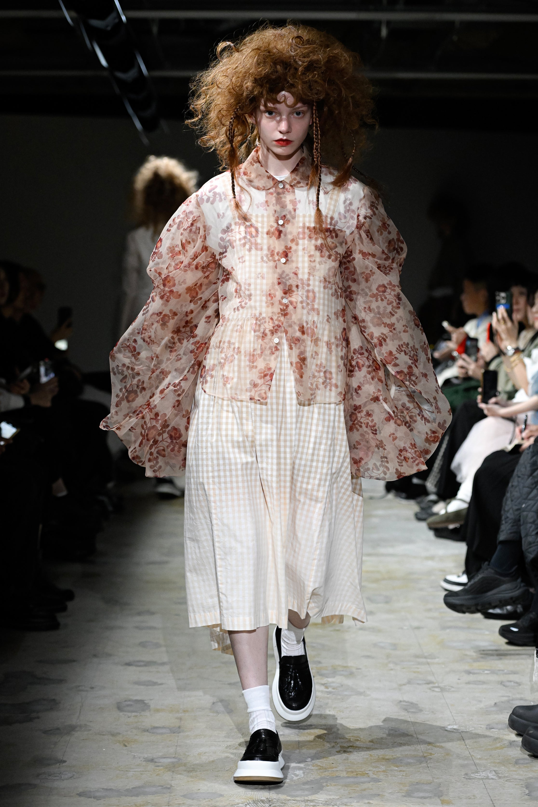 Fashion model wearing a tao SS26 outfit