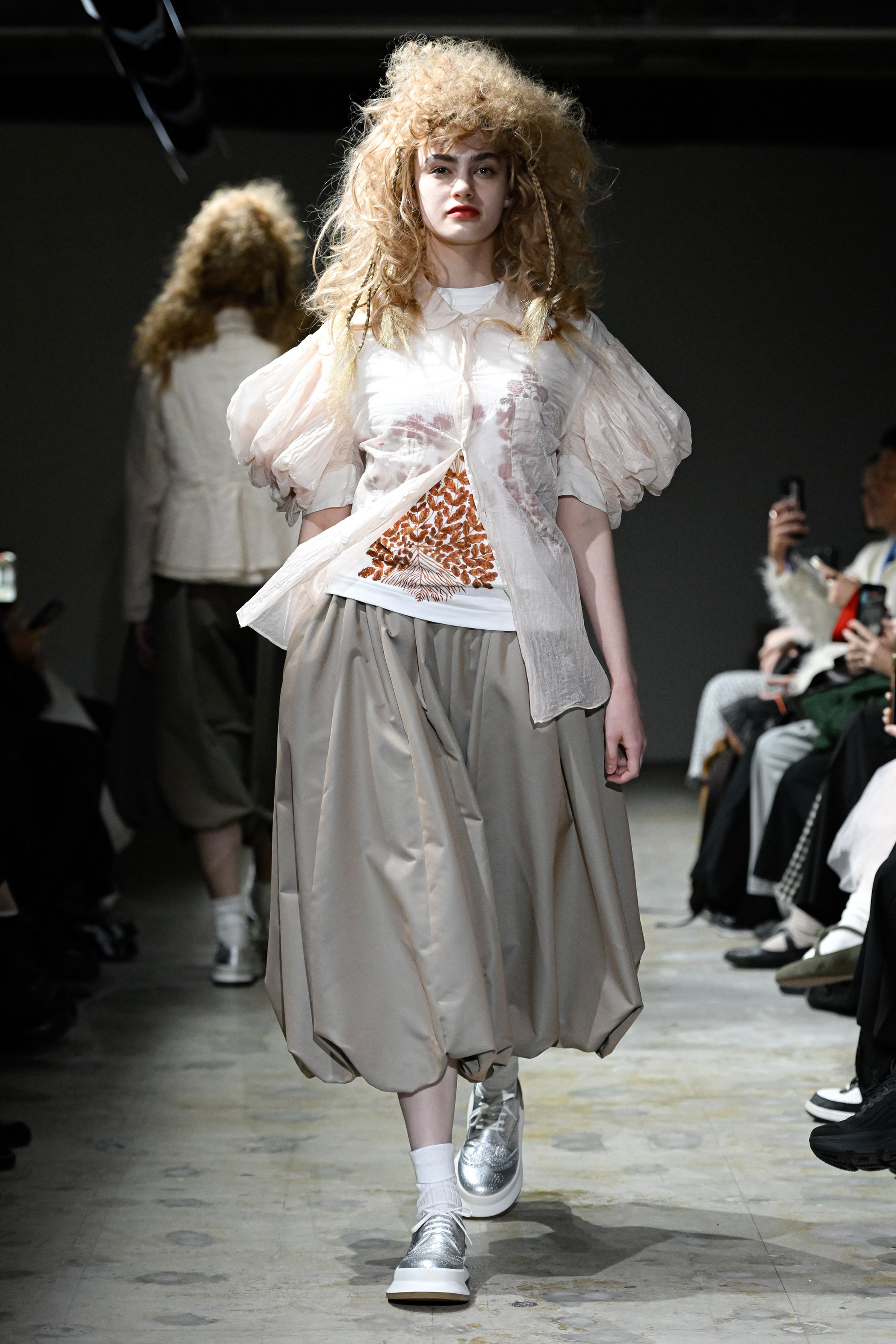 Fashion model wearing a tao SS26 outfit